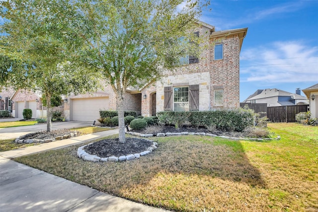 view of front of property with stone siding, fence, concrete driveway, a front yard, and brick siding