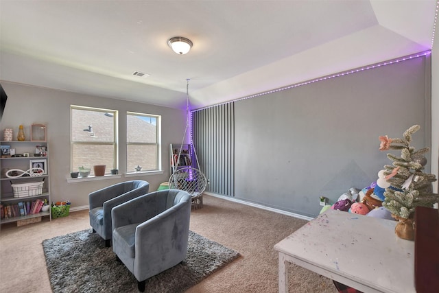 interior space featuring carpet flooring, baseboards, and visible vents