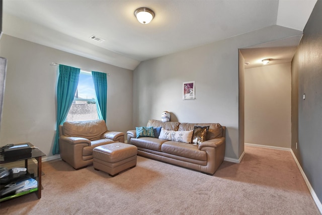 living area with vaulted ceiling, carpet flooring, baseboards, and visible vents