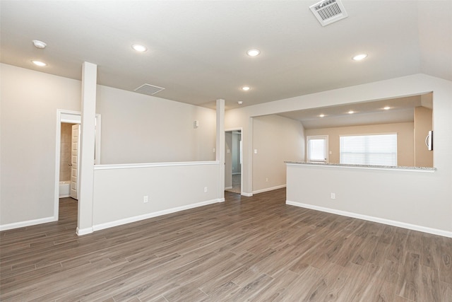 empty room featuring visible vents and wood finished floors