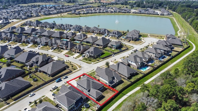 aerial view featuring a residential view and a water view