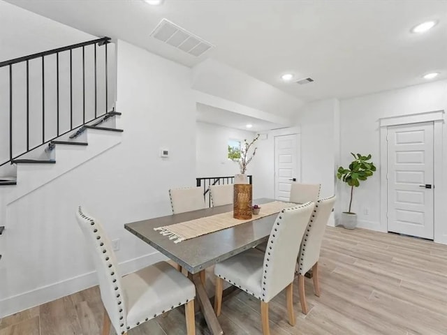 dining room with stairway, recessed lighting, visible vents, and light wood-type flooring