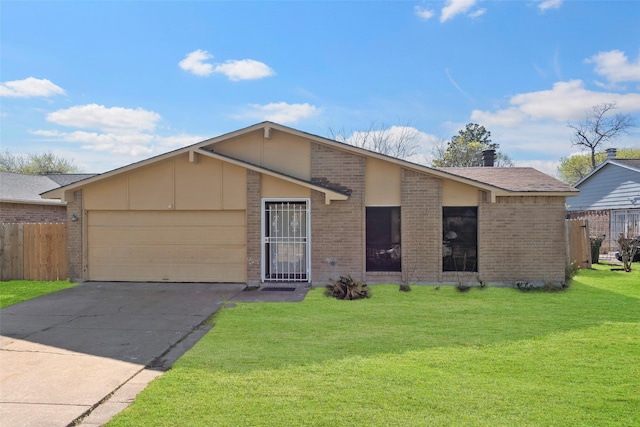 mid-century modern home with a front yard, fence, an attached garage, concrete driveway, and brick siding