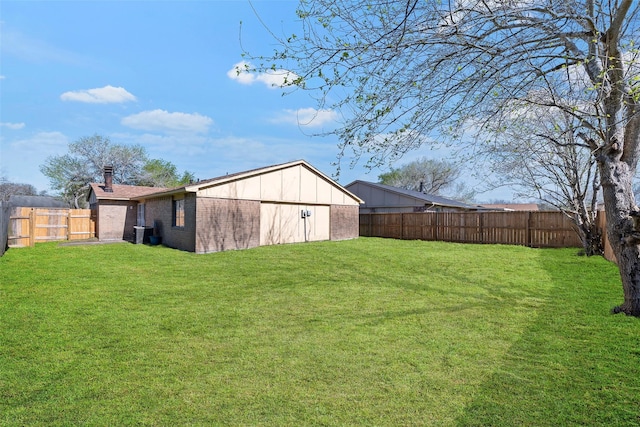 view of yard with central AC unit and a fenced backyard