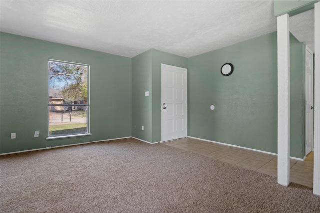 interior space with carpet flooring and a textured ceiling