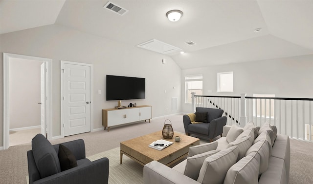 living room featuring visible vents, baseboards, carpet flooring, and vaulted ceiling