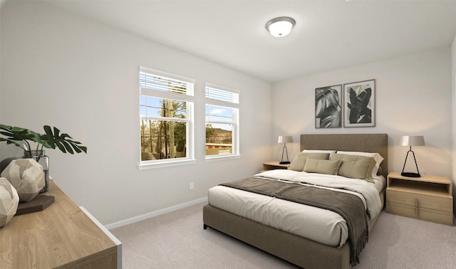 bedroom featuring baseboards and carpet floors