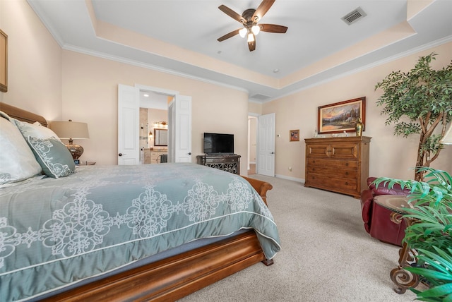 carpeted bedroom with a raised ceiling, crown molding, and visible vents