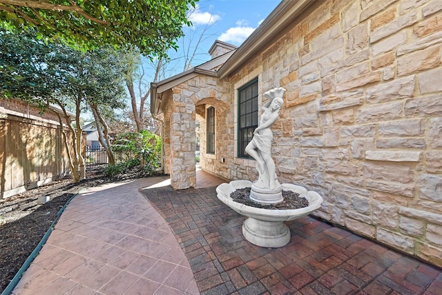 view of patio / terrace featuring fence