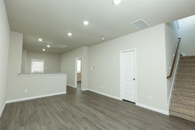 13774 Sunshine Peak Dr, Willis, TX 77318 - spare room with stairs, wood finished floors, visible vents, and baseboards