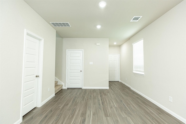 13774 Sunshine Peak Dr, Willis, TX 77318 - spare room featuring wood finished floors, visible vents, and baseboards