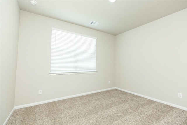 13774 Sunshine Peak Dr, Willis, TX 77318 - empty room featuring carpet flooring, visible vents, and baseboards