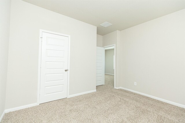 13774 Sunshine Peak Dr, Willis, TX 77318 - carpeted empty room featuring baseboards and visible vents