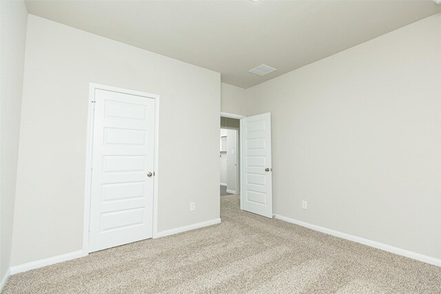 13774 Sunshine Peak Dr, Willis, TX 77318 - unfurnished bedroom with baseboards and carpet floors