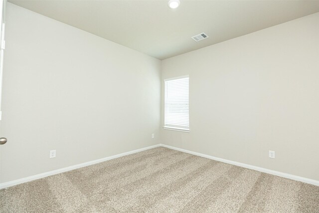 13774 Sunshine Peak Dr, Willis, TX 77318 - carpeted spare room featuring visible vents and baseboards
