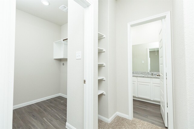 13774 Sunshine Peak Dr, Willis, TX 77318 - walk in closet with wood finished floors and visible vents