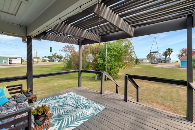 wooden deck featuring a pergola and a yard