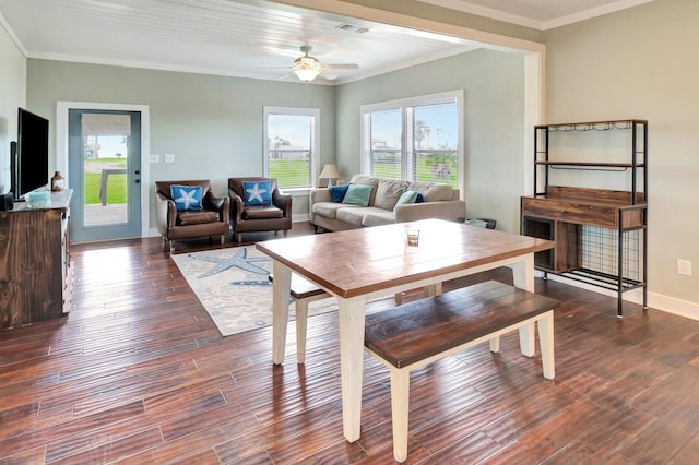 11 Enchanted Ln, Port Alto, TX 77979 - dining area featuring crown molding, a ceiling fan, and dark wood-type flooring