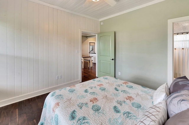 11 Enchanted Ln, Port Alto, TX 77979 - bedroom with ornamental molding, dark wood finished floors, and wood walls