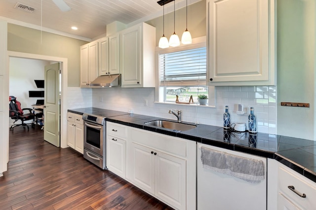 11 Enchanted Ln, Port Alto, TX 77979 - kitchen featuring electric range, under cabinet range hood, dishwasher, white cabinets, and tile counters