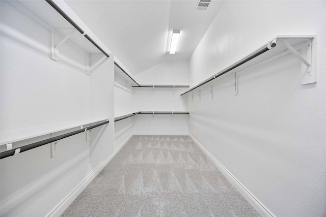 walk in closet with light carpet and visible vents