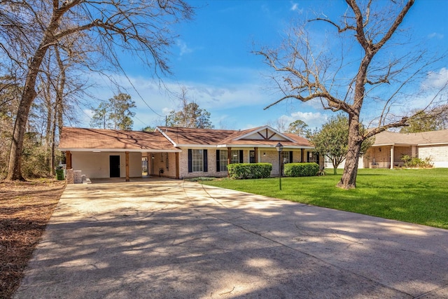 single story home with brick siding, driveway, a front lawn, and a carport