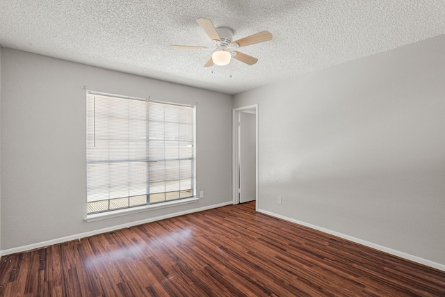 unfurnished room with baseboards, a textured ceiling, wood finished floors, and a ceiling fan