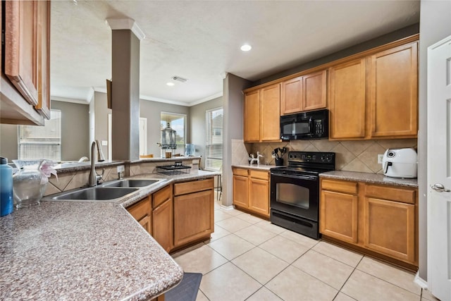 kitchen featuring ornamental molding, light tile patterned floors, decorative backsplash, black appliances, and a sink