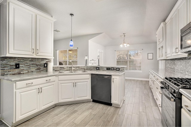 kitchen with black gas range oven, dishwashing machine, a peninsula, white cabinets, and a sink