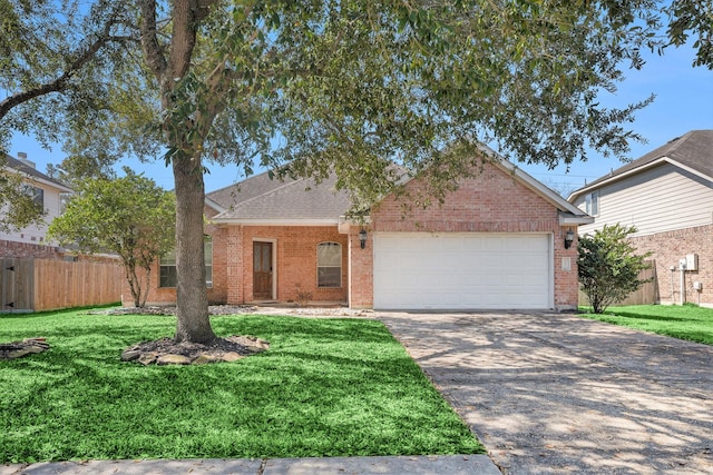 single story home with a front yard, brick siding, an attached garage, and driveway