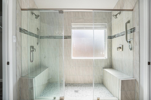 full bath featuring a shower stall