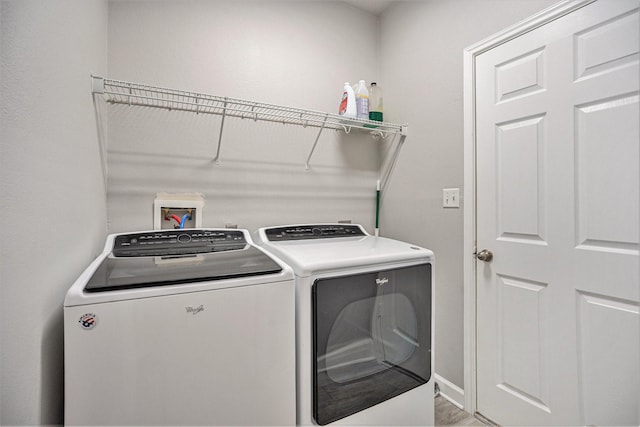 washroom with laundry area and washing machine and dryer