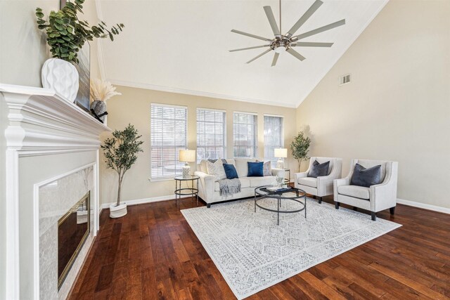 living room with ceiling fan, baseboards, dark wood-style floors, and a high end fireplace