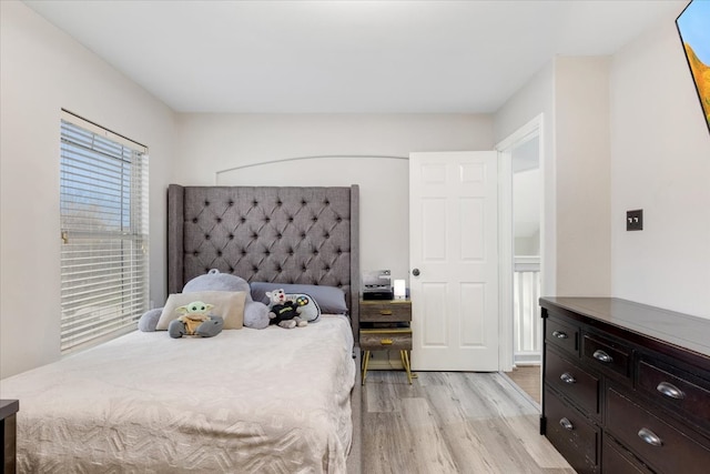 bedroom featuring light wood finished floors