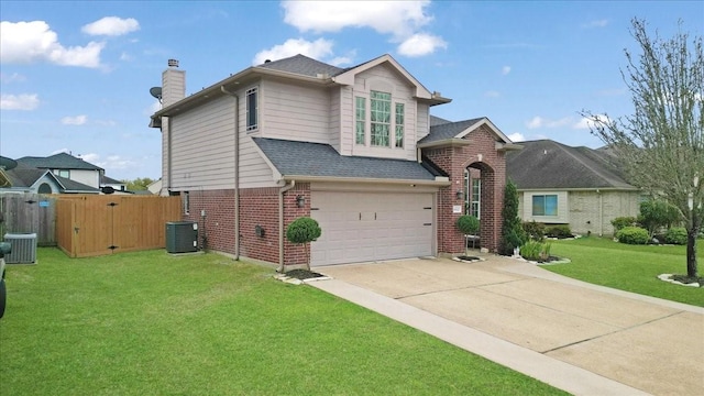 view of front of house featuring a front yard, an attached garage, a chimney, concrete driveway, and brick siding