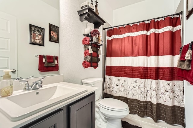 bathroom with toilet, vanity, and a shower with curtain