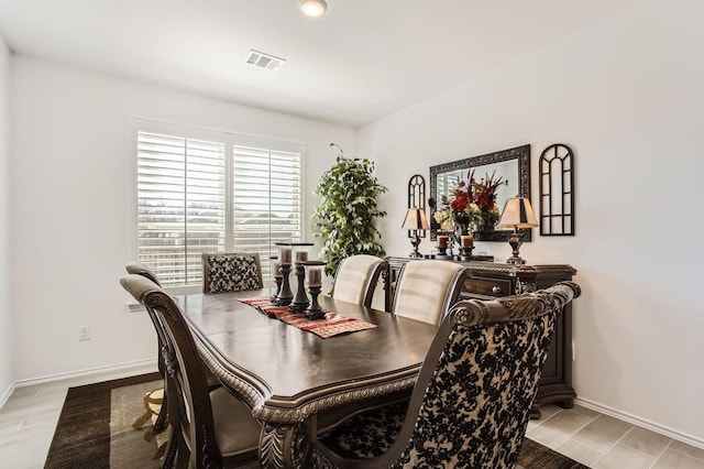 dining area with baseboards and visible vents