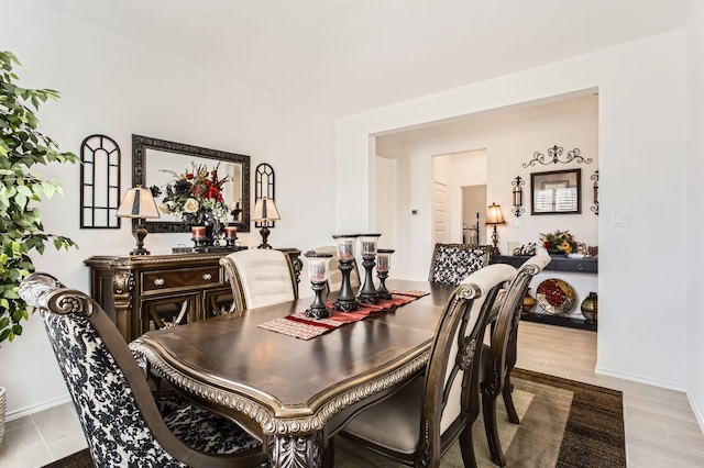 dining area featuring baseboards and wood finished floors