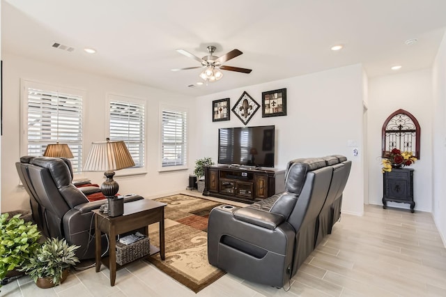 living area with visible vents, recessed lighting, baseboards, and ceiling fan