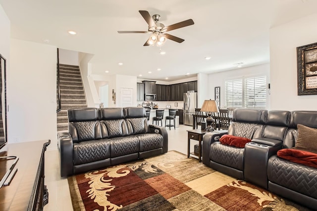 living room with stairway, recessed lighting, and a ceiling fan