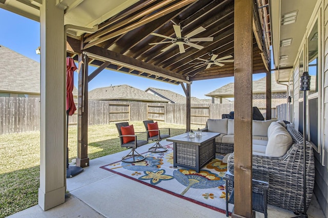 view of patio with a ceiling fan, an outdoor living space, and a fenced backyard