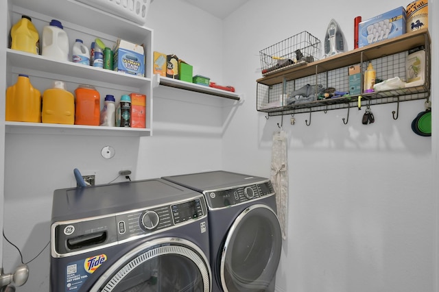 laundry area featuring washer and dryer and laundry area