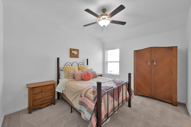 bedroom featuring a ceiling fan and light colored carpet