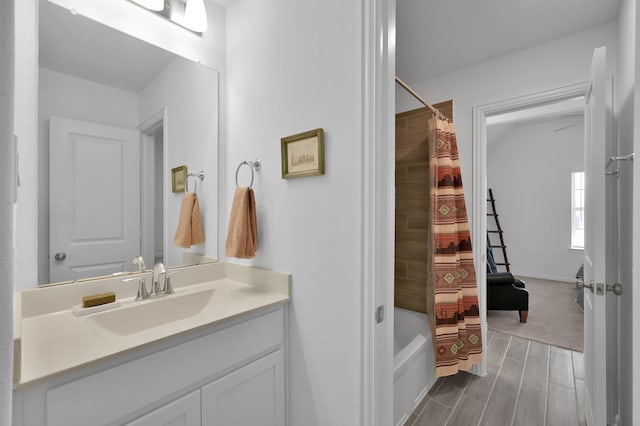 full bath with shower / bath combination with curtain, vanity, and wood tiled floor