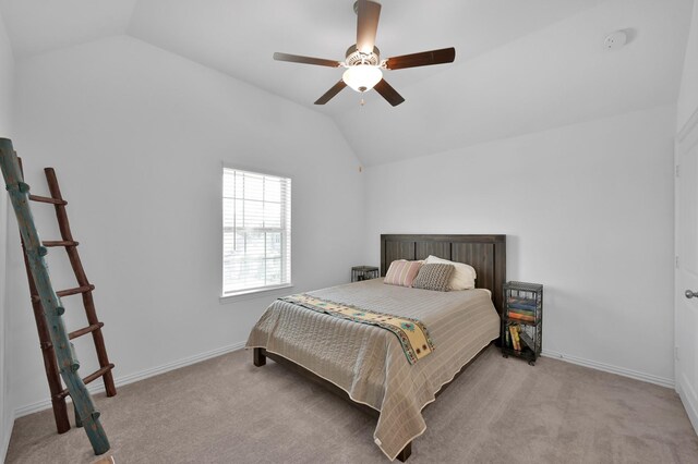 bedroom featuring lofted ceiling, carpet flooring, and baseboards