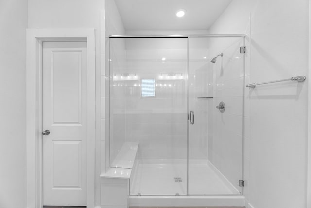 full bathroom with a stall shower