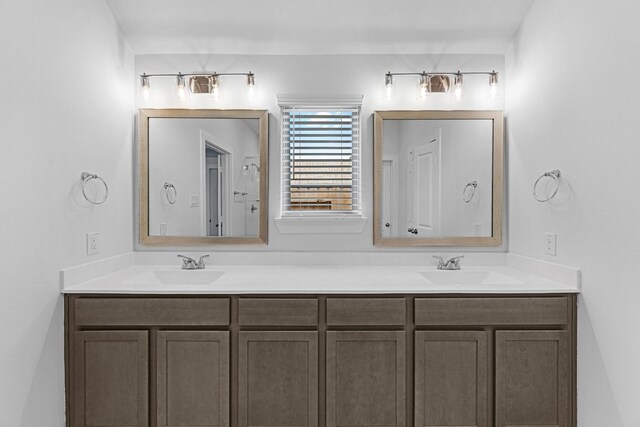 bathroom with double vanity and a sink