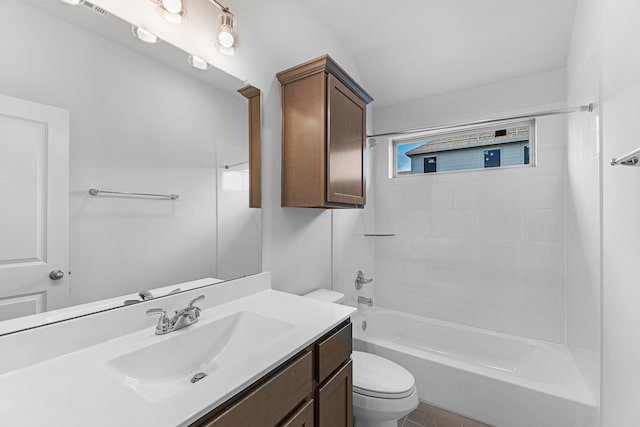 bathroom with toilet, vanity, and  shower combination