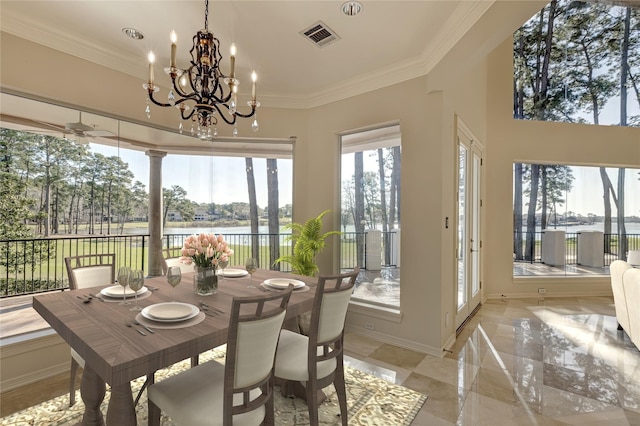 sunroom with visible vents and a water view