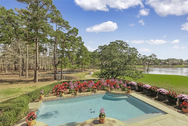 view of swimming pool featuring a fenced in pool, a water view, and a lawn